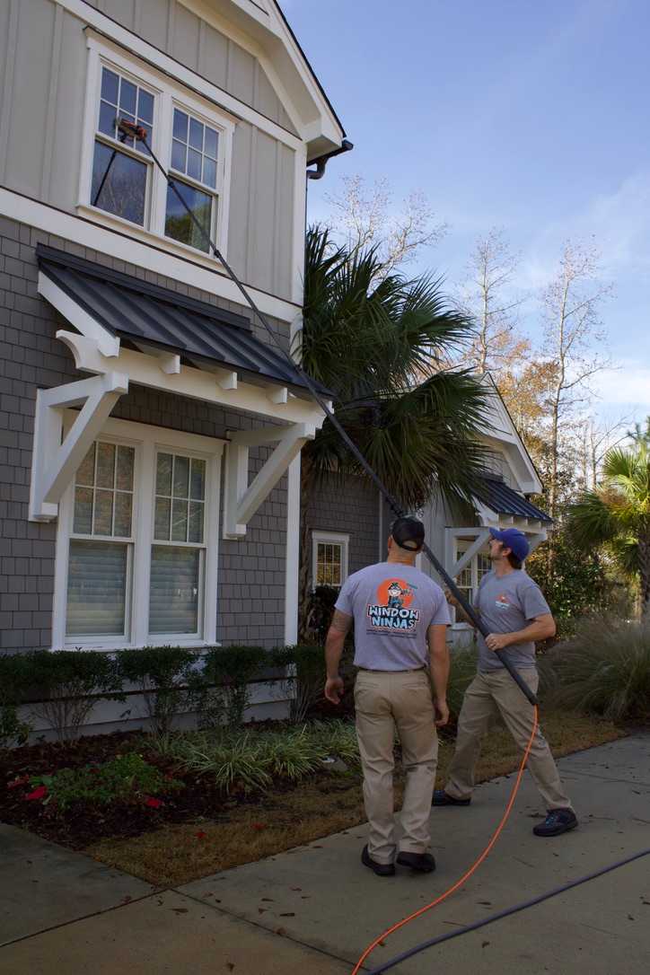 A Window Ninjas professionals providing expert Virginia Beach outdoor window washing services.